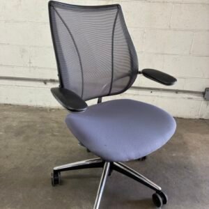 A used Humanscale Liberty ergonomic task chair featuring a form-sensing tri-panel mesh back, a contoured seat cushion, and a sleek frame on a five-star swivel base.