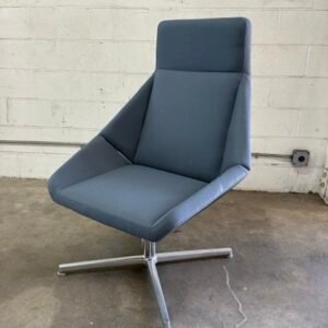 A used Arcadia Nios guest chair featuring a modern, compact design with an upholstered seat and back, sleek tubular metal arms with black leather caps, and a four-leg metal base.
