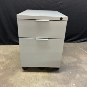 A used Haworth mobile pedestal filing cabinet featuring a box/file drawer configuration, a durable steel body, a built-in lock, and smooth-rolling casters for easy under-desk storage.