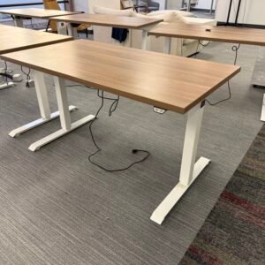 Used MultiTable height-adjustable standing desk with a spacious worksurface and sturdy sit-stand base, designed for ergonomic home office or commercial workspace use.