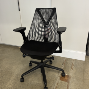 A used Herman Miller Sayl ergonomic office chair featuring a distinctive 3D Intelligent unframed suspension back, an upholstered seat cushion, and adjustable arms on a five-star swivel base.